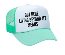 Load image into Gallery viewer, Out Here Living Beyond My Means Trucker Hat: Hunter Green/White