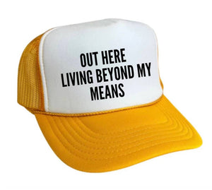 Out Here Living Beyond My Means Trucker Hat: Hunter Green/White