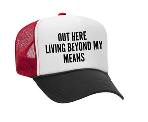 Out Here Living Beyond My Means Trucker Hat: Hunter Green/White