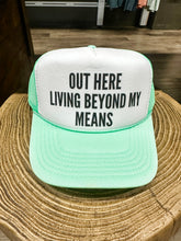 Load image into Gallery viewer, Out Here Living Beyond My Means Trucker Hat